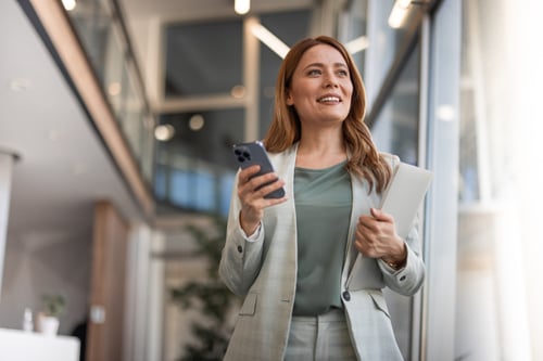 Woman Holding Phone Smiling Woman Holding Phone Smiling